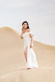 Very stylish and elegant and yet simple. I love the way the dress is off-shoulder so my chest shows, it can emphasize the neck and head. It can emphasize which ever accessory I will wear. It runs true to size. The fabric is smooth and soft - very comfortable. - John P.