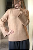 The material is very soft and comfy. It fits exactly as it is pictured on the model. - Emerald B.