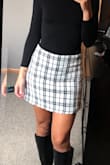 This skirt is super cute and very well made. Nice thick fabric that doesn't stretch out. True to size. - Nicole M.