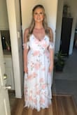 This dress is so beautiful and elegant/flowy! I'm really tall and I could wear this dress perfectly fine with a small wedge. I have large breasts so I was worried a large wasn't going to fit the girls, but I should have ordered that instead of the X-L. But it all worked out, I had my sister take the waist in - which happens sometimes for me anyway because my waist is kinda small. The back is kinda low, so I couldn't wear a bra with it, but it had enough support I felt comfortable without one. It had great quality fabric, and it made me feel so pretty for my engagement shoot! - Kassity W.