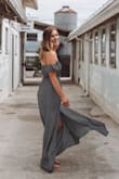 I love this dress! This dress stays put doesn't fall down you don't have to constantly pull it up to keep it on your chest... I am a 34b-34c and there was room if I was fuller chested but didn't look slouchy. - Molly R.