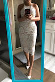 It fits me really well and really cute. At first I was skeptical about the nude layer inside look kind of cheap, but it looks fine when I wear it. The only reason I give this a 4 star is because the strap looks very cheap and doesn't match the dress... but I notice that in most of Lulus dresses too, so if youu doesn't mind, then it's a cute one to go for. - Quynh L.