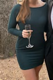 I got this dress for a wedding and I got so many compliments! The fabric is thicker so don't worry about it looking cheap. It's also a perfect length (not clubby short but not Church long). The color is beautiful! - Sarah A.