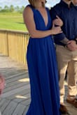 I wish I had the dress hemmed before wearing it but I managed to walk around in it just fine. The material was very comfortable. The slit up the side doesn't show unless you pose a certain way on purpose. It was lined so I didn't have to wear a bra. I would order this in other colors! - Mandy M.