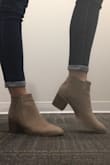 I just got these boots in yesterday and I was so excited to put them on. I read the reviews beforehand and it said that they run a little large so to order down half a size and that's what I did. I normally wear a 9.5 but I ordered a 9 and they fit great. The website picture looks like the boot has a pink hue but they are definitely tan. Would definitely recommend! - Kalie R.