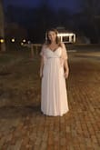 I ordered this dress as a bridesmaid dress for my best friend's wedding and everyone loved it. I'm 5'2" and a size 10 american and I felt it was a bit too tight as I ordered a large size. I should have gotten the XL and then altere it. The material was great but it is quite heavy as there are many layers. I also had to get it shortened. Overall I was very happy with the quality and the colour. - Dacil A.