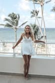 I got so many compliments on this romper. It fits TTS and it can easily be dressed up or down. I do recommend white or nude under things though cause dark colors to stick out. I ended up buying this in black as well but the white was a show stopper. - Meredith P.