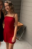 I fell in love with this dress online, and couldn't stop thinking about it. I went to several stores and something kept bringing me back to this dress. I ended up ordering it, and I was very excited. I ordered a small, because that is what size I usually am, but when it came it was too large in the bag where it couldn't be adjusted. I was running out of time before my semi-formal, and decided to risk it and order an extra small with expedited shipping and to return the other. It came just in time and fit perfectly. I recommend purchasing two sizes and returning one because the material does not have a lot of stretch to it. This dress was exactly what I wanted and looked really good in pictures. - Carley B.