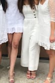 This fits like a dream!! The strapless top stays up, and the material is so thin you keep cool but also isn't see through. I'm short, so I didn't know if I could pull a jumpsuit off because it wouldn't be too long, but this was the perfect length. The buttons are adorable. Highly recommend! - Christa H.