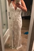 The top of this dress is beautiful. An XS fit me well. The only thing I don't like is that at the slit, the under slip and the lace top don't line up. - Marissa V.