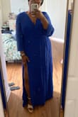 The color is absolutely beautiful for any occasion! The leg slit and the V-neck line were both extremely flattering and sexy without being too overboard. The only issue I had (and why I ended up choosing another Lulus dress and returning this one) is that it runs large. It was large in the waist area where it's supposed to cinch in and the sleeves were super long. The dress has the potential to be way more flattering if maybe I sized down (I purchased my regular XL size). In the picture you can see that I actually pulled the cuff of the sleeve as high as it would go in order for the rest of the sleeve to billow over it. Length wise, I am 5'7" and was wearing 2-3 inch heels and it was just the perfect length! - Aliyah C.