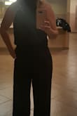 This jumpsuit is the bomb! You can have a little bit of a tummy and not huge breasts and this will accentuate your breasts and minimize the tummy. It fits nicely in the legs. I am so excited to wear this with Lulus burgundy fringe earrings. I realize my photo is poor quality, but it is the only photo I have taken so far. - Mary M.