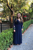 Pretty dress bit runs long, had to get it altered. The bust can be a bit revealing and had to constantly look down to make sure I wasn't showing anything. Bought a bra close to the color of the dress which helped. - Andrea T.