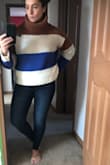 Absolutely love this sweater. It's super cozy- perfect for winter get togethers. It's a shorter cut which I love. I'm 5'1 and it hits right around my hips. I got an XS which I normally get when buying flowy tops and it fits as expected. I may need to purchase the other color! :) - Jenn M.