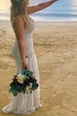 I wore this as my wedding dress in Jamaica. I am usually a size 8/10, but ordered a Large because of my curvy figure and It fit perfect, no need for any alterations. I received so many compliments, I absolutely love and highly recommend this dress! - Stephanie B.