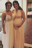 I wore this dress while 8 months pregnant and it was amazing! So comfortable! I bought a small which is what I usually wear and it was great. I bought the blush pink color and ended up purchasing nude spanx so it wasn't see through. A bra wouldn't work so I wore pasties and that worked very well. I would definitely recommend this dress! - Abby M.