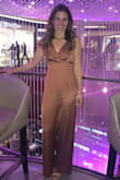 Loved this jumpsuit so much. I was able to get away with no bra but the straps needed some adjusting. The length was perfect with some heels too. I'm between 5'5" and 5'6". I'd normally be a small but I tried it and the XS definitely fit better, so size down. - Karen S.