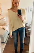 The cream has a hit of a yellow hue to it and not true cream color so I wasn't sure how I felt when I opened it up but the fit is very comfortable, I prefer it tucked in then the full hem rolled out. Cute, reliable sweater. - Lyndsey F.