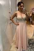 Its such a beautiful dress very heavy from the top. It was really long on me so I took it to get it altered. I'd say it runs true to size. Got many compliments on my dress. - Patricia Z.