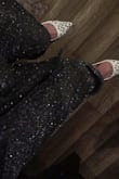 These pants are super sparkly. They are very comfortable but would size down a bit they are a bit baggy on me, and go all the way to my ankle.  I'm short and curvy. They are cute pants however! Love the Stretch! - Marrisa T.