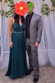 The color was gorgeous! It's a bit darker than the picture, like a hunter green. Material was nice, thick, and has a satin under layer. I'm 5'4 and wore 4 inch heels but it was still too long. Had to hem it to fit. It was nice that the ties in the back is flexible to fit as needed. Bust is lined so bra wasn't needed. - Kaila T.