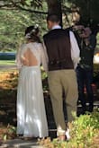 To make a long story short, I planned my wedding in less than a month. My dad is terminal with cancer & I couldn't picture my wedding day without him. I found this dress & fell completely in love. I'm short - not even 5 foot tall, so I'm used to every dress needing some sort of alterations. Besides needing it hemmed, my seamstress took in the top a little bit to make it more snug/ fitted. The sleeves were also a little baggy, but honestly, no one could tell. The dress is absolutely beautiful & such a steal for the price. I'm still getting compliments a month later! It's very well made & has many layers so it's not see-through. I 100% recommend this dress to anyone! - Courtney V.
