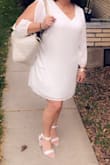 I got a 1X, I usually wear a 16/16W in dresses, 14 in jeans & 16 in pants. I have a wider frame & hips. It was a little too big and I wanted to show off my curves a bit. I ended up getting it taken in on the sides above my hips & up at the shoulders- I'm short, it was too much cleavage for me. If I had more time, I would have exchanged it for an XL. I wore it to an all white event and loved it though- good quality. - Karlie H.