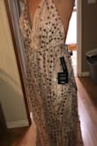 Ended up finding this dress by accident while looking for bridesmaid dresses, the sparkle, cut, and fit are absolutely perfect for the girls that can go braless. The two photos are of two girls both wearing a small, one is a 32B one is a 34DD in two different lightings. Wonderful color and even though sparkly it is every elegant - Hailie B.
