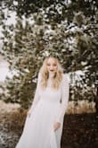 I got this dress for our elopement in Colorado and it was amazing! It fit like a glove! I did get it hemmed cause it was a little long, but I would do it all over again. Love this dress and so glad I chose it. - Lauren B.