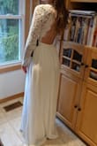 I am obsessed with the back of this dress. I ordered this hoping it would work for my casual autumn wedding. This dress is nice and long which is great for tall ladies like me - it is even a little long for me at 5'9. I wasn't sure between a small or medium but ordered a small based on other reviews and the helpful live chat associate. The small would still need to be taken in a little at the waist and the sleeves are a little loose, but these would be minor alterations. I think I was a little disappointed with the quality of the lace - as others have mentioned, it's a thick crochet-type lace, but the material feels and looks a bit cheap up close. I decided to return the dress... For the price, it's amazing, but I do want to make sure I feel extra special and elegant on my wedding day. :) - Clare W.