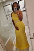 I paired the dress with a silver belt and loved it even more. I wore 6 inch wedges and it still dragged the floor not that I minded - Yasmine W.