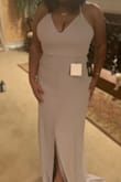 It's a nice dress.seems like quality material. I'm 5ft 1nch y'all. I have to get the split height and get it hemmed. But that's a height problem short people like myself are used to. Love the back. - JoJo M.