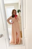 I ordered this dress in a medium and a large because of the reviews; relived I did because the medium fit perfectly. I didn't even bother to try on the large; The dress definitely runs larger. Very nice material; when I picked up the dress my first thought was "this dress is kinda heavy!" Great quality of fabric though. I will need to hem the dress and do something about my cleavage showing too much; but fits great everywhere else. 

My brother's wedding is in 7 months so I can't wait to pull my look all together and get a spray tan! - Michele B.