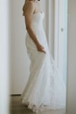 I bought this dress for my wedding, as I was disappointed with all the styles I had tried in wedding dress boutiques.  At the time I thought it was a gamble - but this dress FAR exceeded my expectations.  It fits true to size, and the style is exactly as simple yet pretty as pictured.  I didn't even need a bra, as the bust of the dress is firm and provided good support. The quality of the material is excellent, and every one of my friends was shocked when I said it didn't need altering in any way when I bought it! On top of that, the shipping process took only 7 days for the parcel to reach me in New Zealand. Super super happy with this purchase, and it made my wedding day everything I had dreamed of. - Tigga W.