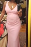 Dress fits very well.  Love the flare at the bottom after a form fitted top.  Enough stretch to allow a fuller figure to wear a medium without being too tight. - Lorie J.