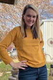 After reading reviews I decided to order a full size down and that's definitely the way to go with this sweater. Lovely color, nice detail on sides and back. I'm 5'8" and 150lbs so I never fit into a size small top, but this size small fit me perfectly. (I'm normally a medium) - Aryn C.