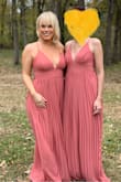This dress is perfect!  Loved the color!  It's a bit long but with heels it turned out perfect.  I have a booty,  bust and hips,  this dress hid the flaws and showed the curves.  The straps tighten nicely.  If you are busty this dress with allow some visibility to the boobs.  The dress needed to be steamed before the wedding,  it was pretty wrinkly.  For the price this dress met all my expectations and the brides too boot! - Katie C.