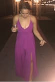 I'm absolutely obsessed with this jumpsuit! The material was flowy and light. I got compliments all night long. It was quite long, so my mom hemmed the bottom about an inch and with heels it was perfect. I can't wait to wear this bad boy again! Side note- this was the best 'front' photo I could find to get the full effect! - Jillian L.