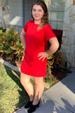 Great dress. Loved the color a bright cheerful red. Wore it to a family wedding with short boots. I'm on the petite side so it was a little long but loved it. - Cailtin S.