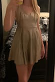 It was super cute and I would definitely wear it but it is very short. If you bend over you but will be showing, again it was super cute I just would mot recommend bending over in it. The backless is really flattering. - Camryn B.