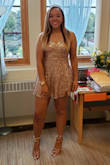 This dress is made with a slightly stretch material which is perfect for different body shapes. The top is more form fitted and the lower half flares out slightly. The straps are adjustable for varying bust sizes, I am wearing the dress with the straps tightened all the way. I am 5'9 and 165 pounds with long legs and a shorter torso, a little curvy, so the dress was long enough to cover my butt. I usually wear a juniors medium top or adult small and juniors 9-13 in jeans. The medium was perfect. There was still room so it wasn't too tight and likewise it was not hanging off me. I wore this dress for homecoming at my highschool and it was perfect, I received so many compliments. The rose gold is really bright and the sequins are super sparkly. Don't forget the matching shoes and earrings. The price for the entire outfit was a great bargain, even if I never wear it again. Everything came packaged so nicely and delivery was right on time.
((It was volleyball season excuse the court burn on my knee)) - Angela B.