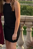 It's a little tight around the stomach area but still flattering! It's very nice that is adjusts around the neck and a perfect length, a little above the knee. - Koree C.