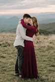This dress was perfect!! I ordered it for our engagement pictures and it was perfect. The best dress for a gorgeous outdoor mountain scene or even a wedding. It's very flowy and the slit makes it very sexy and elegant. It definitely is cut really low in the front and if you're busty like me "the girls" show! I ordered a small and might would have gone up to a medium for that reason. But the small worked just as great. - Maeson K.