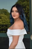 I will say that the first dress came in with some stains but I was able to get a replacement within a few days! The dress came in on time and it looked beautiful. Not tight at all, more of a comfy stretchy material. It was able to hold my chest up perfectly without a bra which is a plus!! The simplicity of the dress just brought out the blue in my hair! Definitely will be buy from Lulus again! - Madison A.