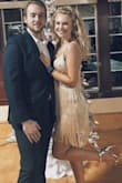 Runs a little small, tight skirt under fringe. Dress is meant for twirling!! Sparkles do fall off quite a bit. - Lindsey J.
