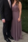 I absolutely loved this dress and it was perfect for a black tie optional wedding! The dress fit perfect at my waist and flowed from my hips so that I was comfortable but it was still flattering. The top of the dress was large on me though and I'm a 32D so for girls with a smaller chest I would definitely size down or get it altered. I safety pinned mine so the plunge wasn't as deep and it helped me feel more secure in the top, but if I leaned over the strap would fall off my shoulder which could be an issue. I'm keeping the dress but I will probably get it altered before I wear it again. Colors most accurate in first picture! - Jordan O.