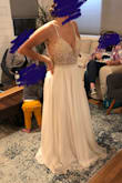I really loved how this dress made my bust look. Being a bigger bust, but smaller waist is hard to find! It only needed hemmed. I would imagine the inside of my arms probably would've also gotten annoyed with the beaded detail, but it was so sparkly and jaw dropping in person, I wouldn't have cared. It seriously lights up in the light. So pretty! The only reason I decided against it was only for a different look. - Mackenzie H.
