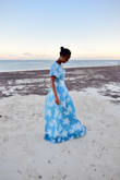 I purchased this dress for a beach wedding in Mombasa. The dress surpasses my expectations. It's beautiful, elegant and simple. The length was a bit long but considering my height it was expected. I had it tailored to fit my size. I highly recommend it. - Birukti H.