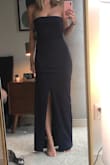 It's flattering, upscale, and sexy. I wore it to a wedding and got lots of compliments.
I'm 5'7" and had substantial heels (3 inch maybe?) and needed to pin it up an inch, so definitely buy this with time to take to the tailor (I wish I had!) - as you can see in the photo I'm holding it up a bit off the ground.
My only downside was the bow in the back - it was a little large and cumbersome so it stuck out a little. Very sexy silhouette from the front and side though! - Joslyn B.