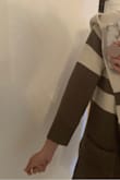 The sleeves were an awkward 3/4 length that seeing from other reviews and the product images is clearly due to a major defect. I am petite and usually arm lengths are long on me. It is soft and may exchange to see if I have better luck. - Santy F.